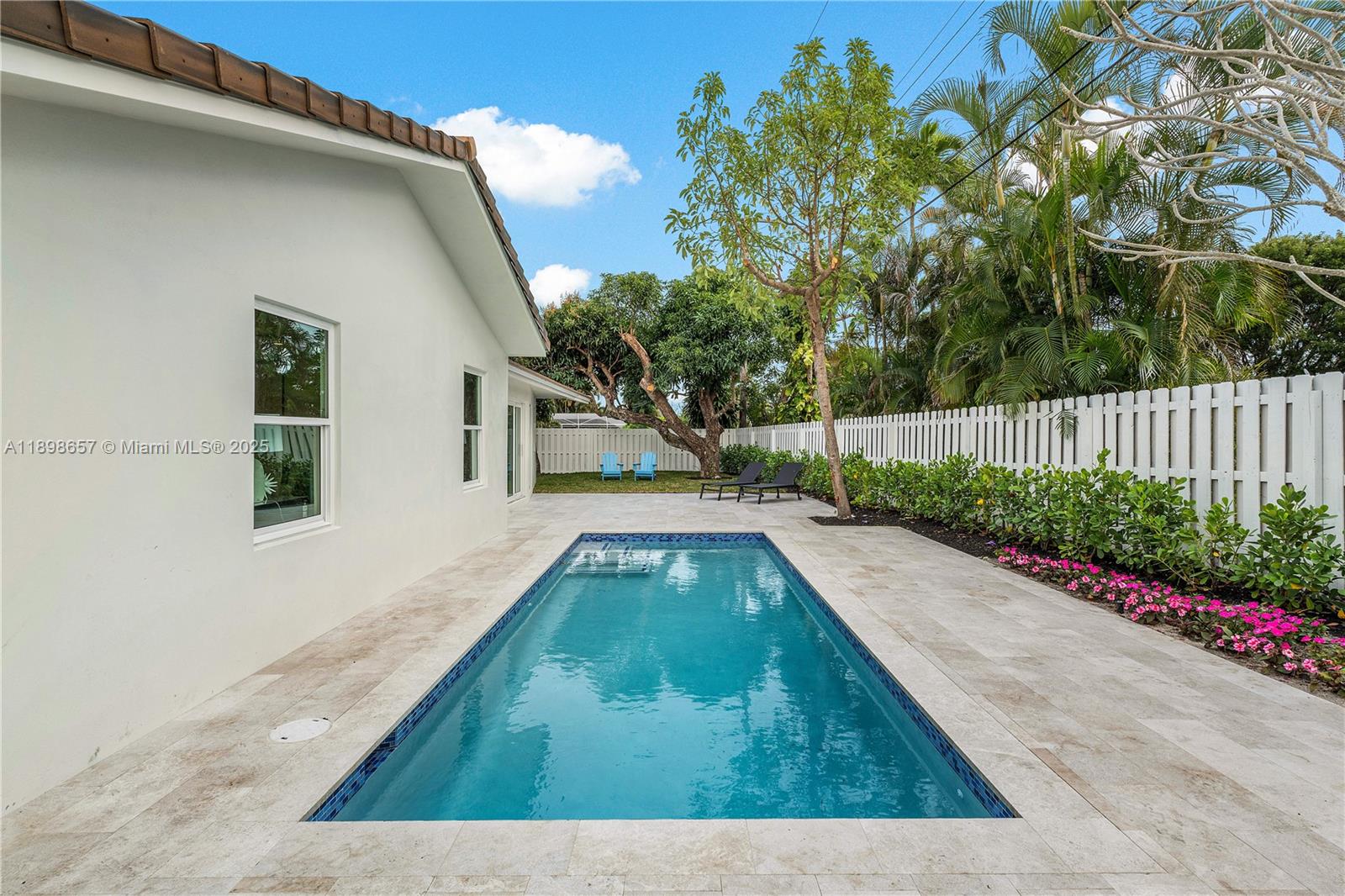 1338 Southwest 13th Street Boca Raton, FL 33486 - Photo 28 of 45 a view of backyard with swimming pool