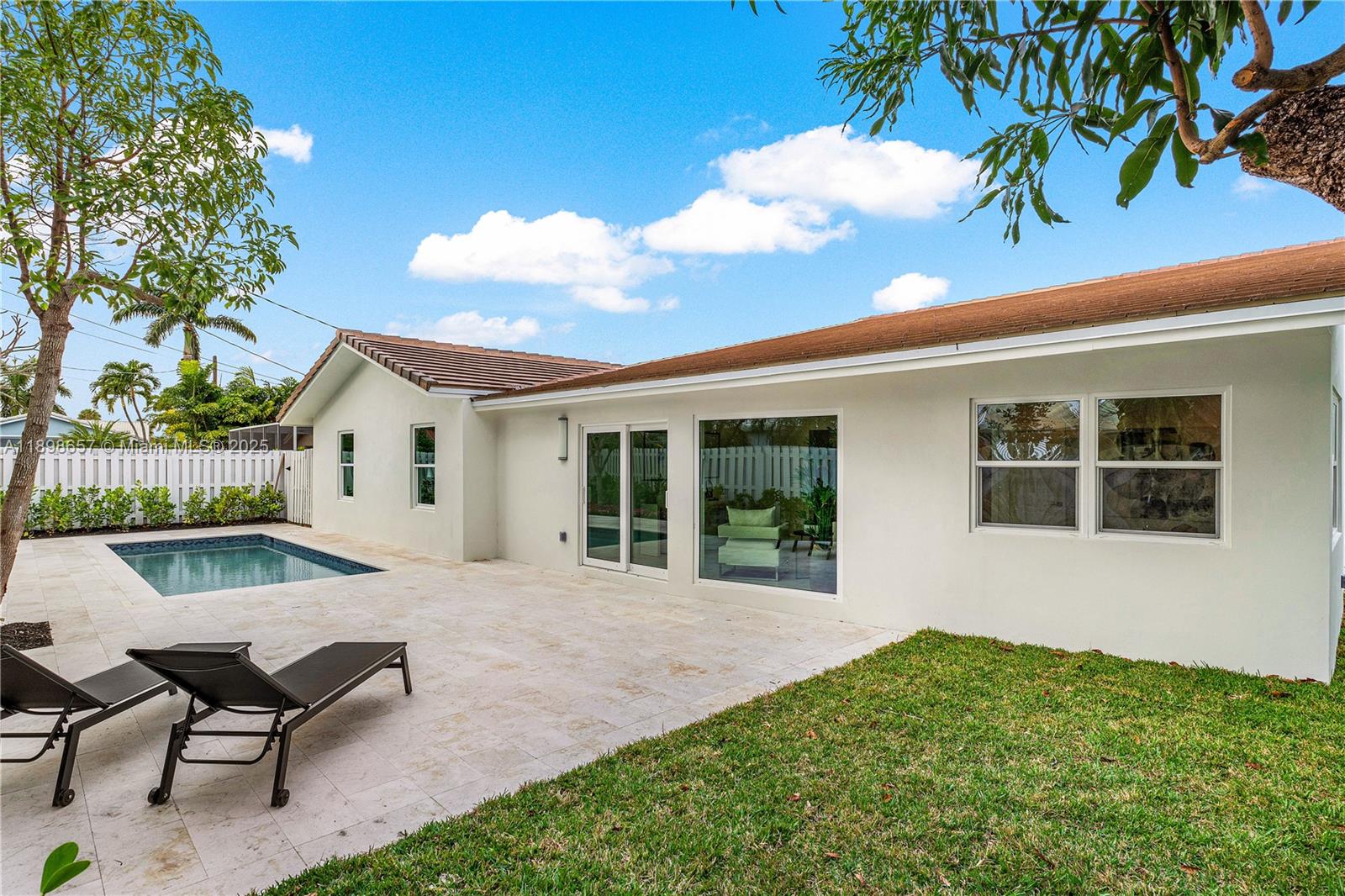 1338 Southwest 13th Street Boca Raton, FL 33486 - Photo 29 of 45 a view of a house with backyard porch and sitting area
