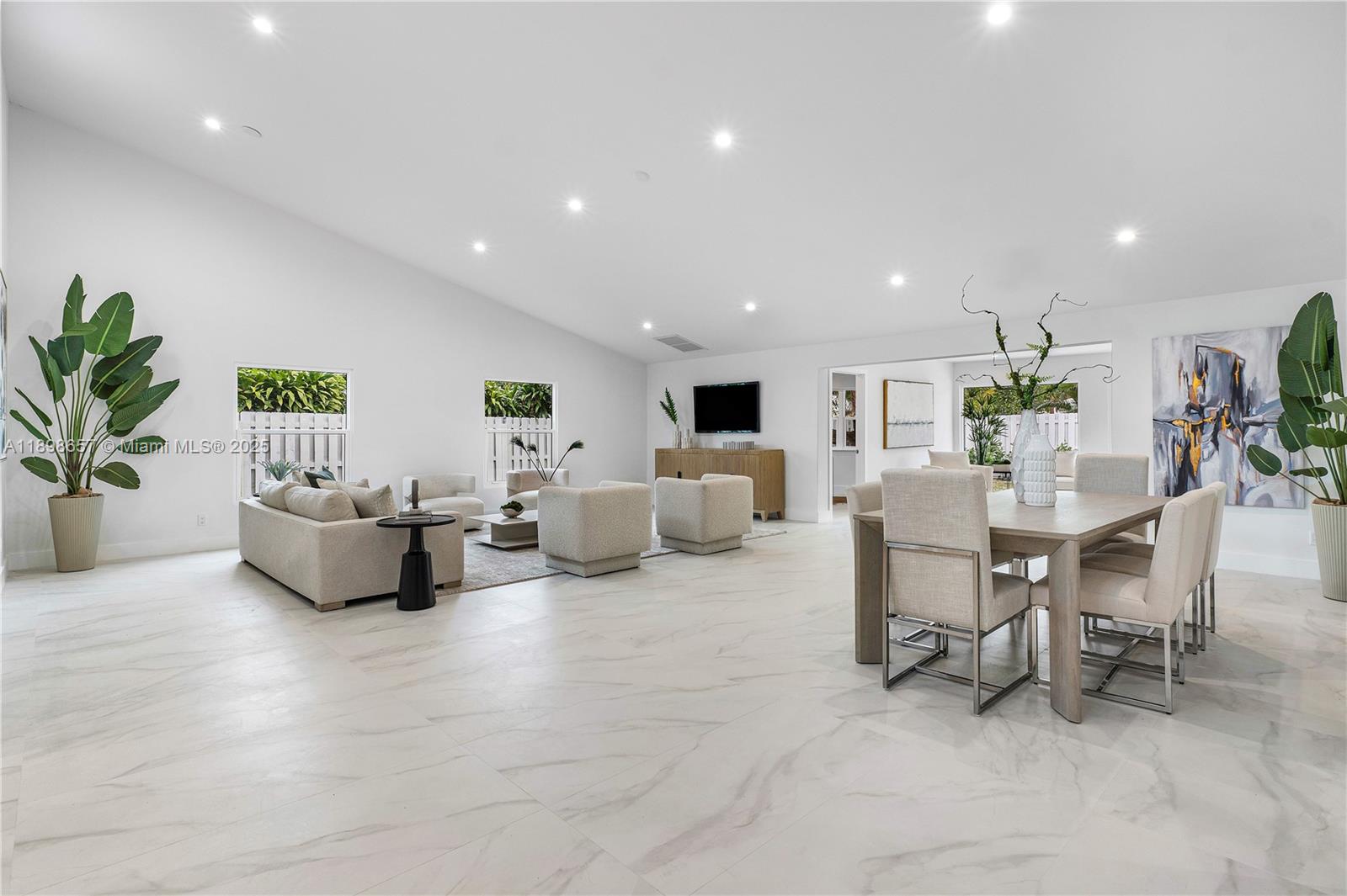 1338 Southwest 13th Street Boca Raton, FL 33486 - Photo 4 of 45 a living room with furniture and white table