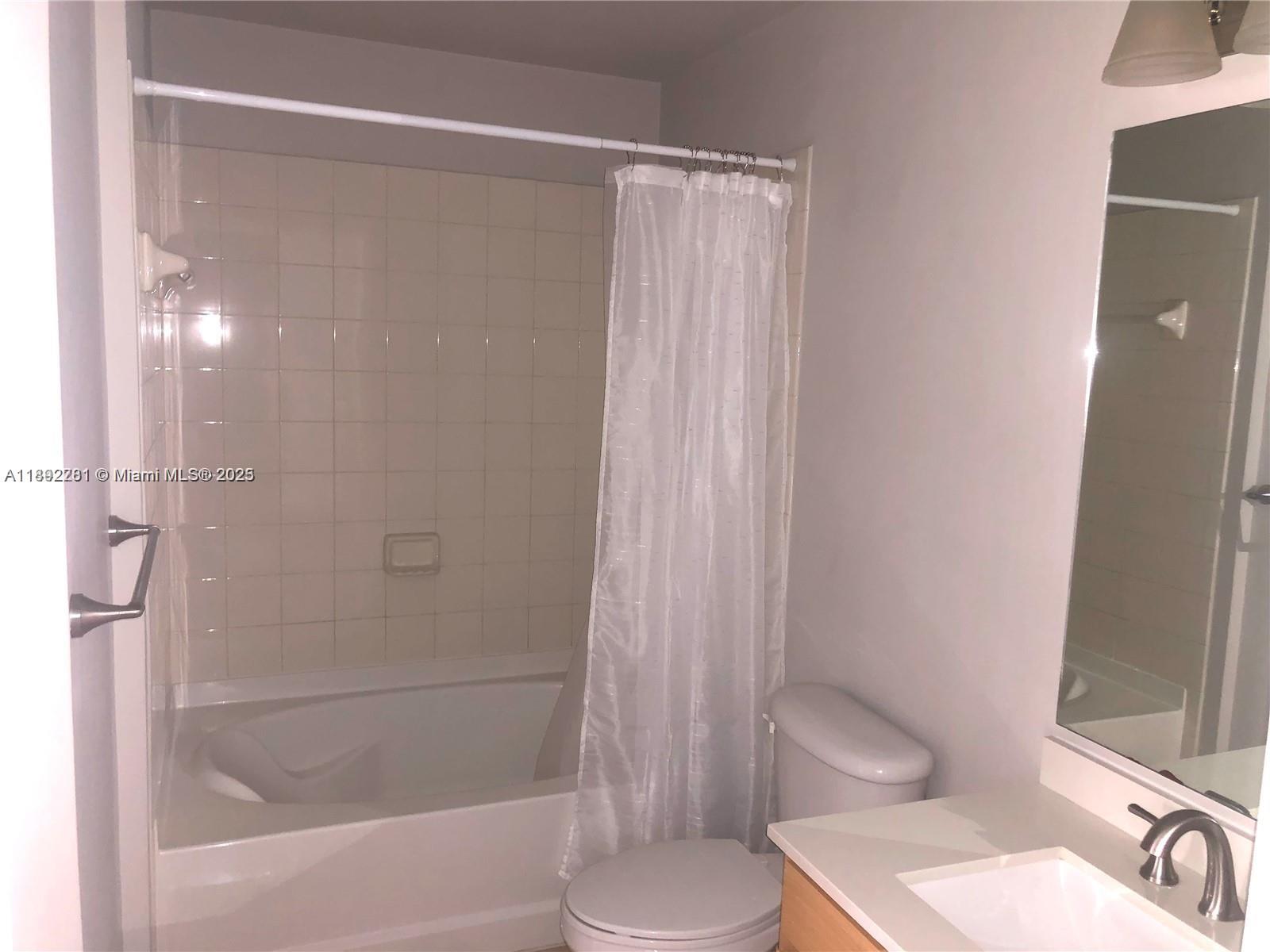 6001 Southwest 70th Street, Unit 528 South Miami, FL 33143 - Photo 15 of 21 a bathroom with a shower and a toilet