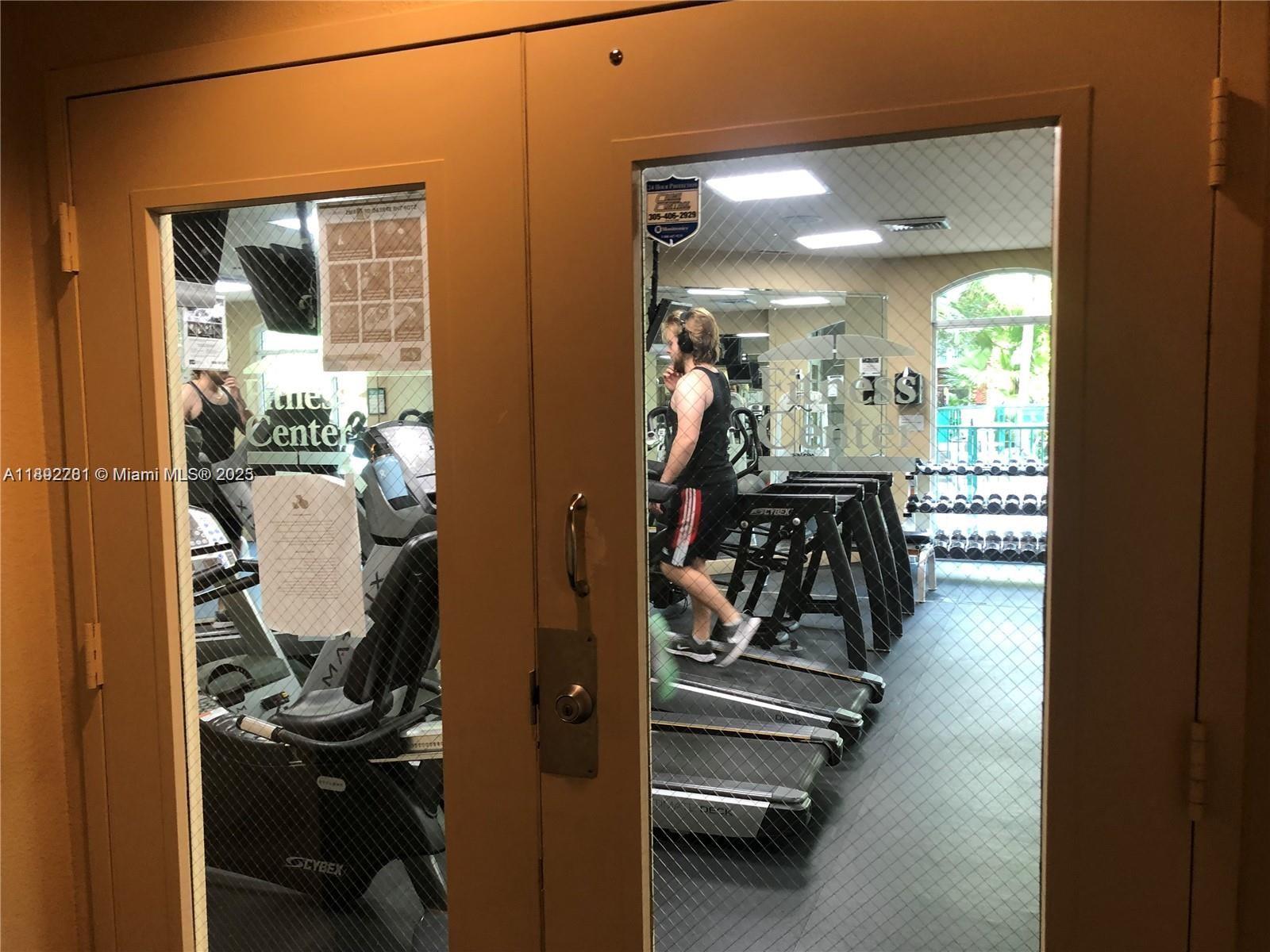 6001 Southwest 70th Street, Unit 528 South Miami, FL 33143 - Photo 21 of 21 a view of a room with gym equipment