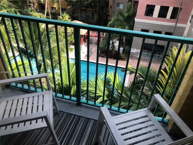 a view of a balcony with wooden floor