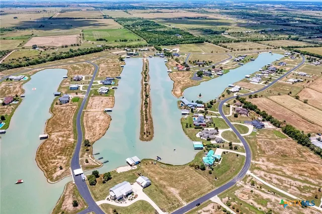 an aerial view of a residential building and lake view