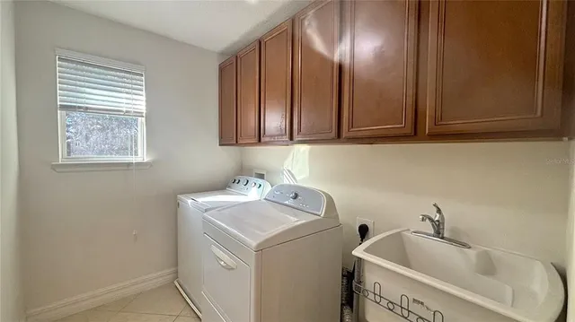 a bathroom with a sink and cabinets