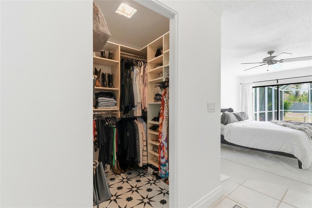 3927 Country View Lane Sarasota, FL 34233 - Photo 16 of 48 a bedroom with a bed and a window