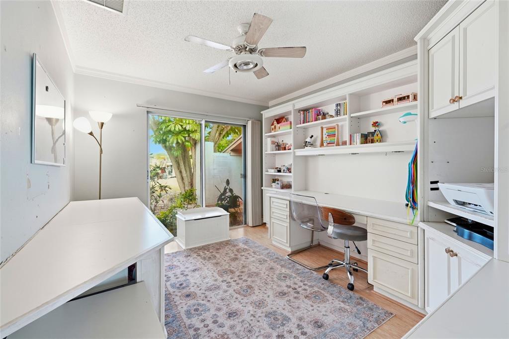 3927 Country View Lane Sarasota, FL 34233 - Photo 20 of 48 a room with furniture a rug and a window