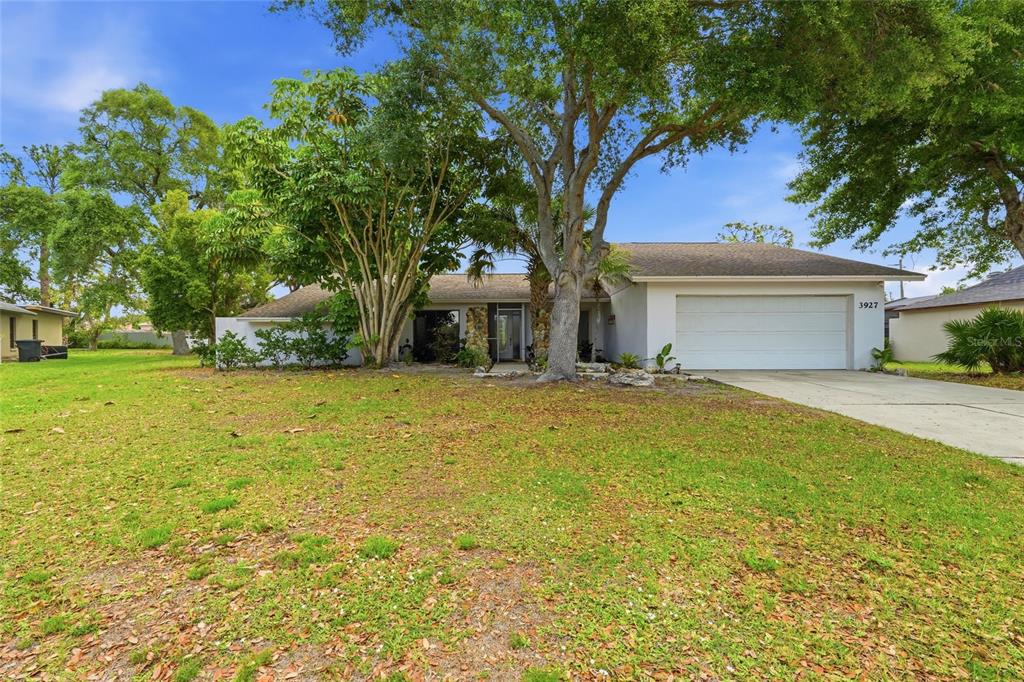3927 Country View Lane Sarasota, FL 34233 - Photo 2 of 48 a house view with a outdoor space