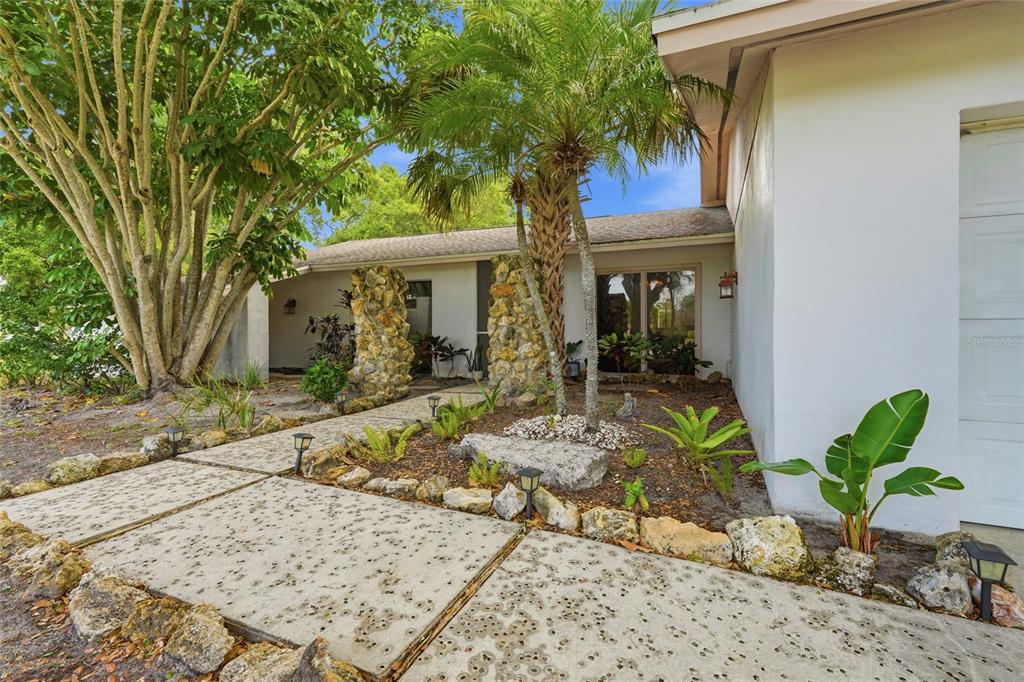 3927 Country View Lane Sarasota, FL 34233 - Photo 3 of 48 a view of a dinning table and chairs in patio