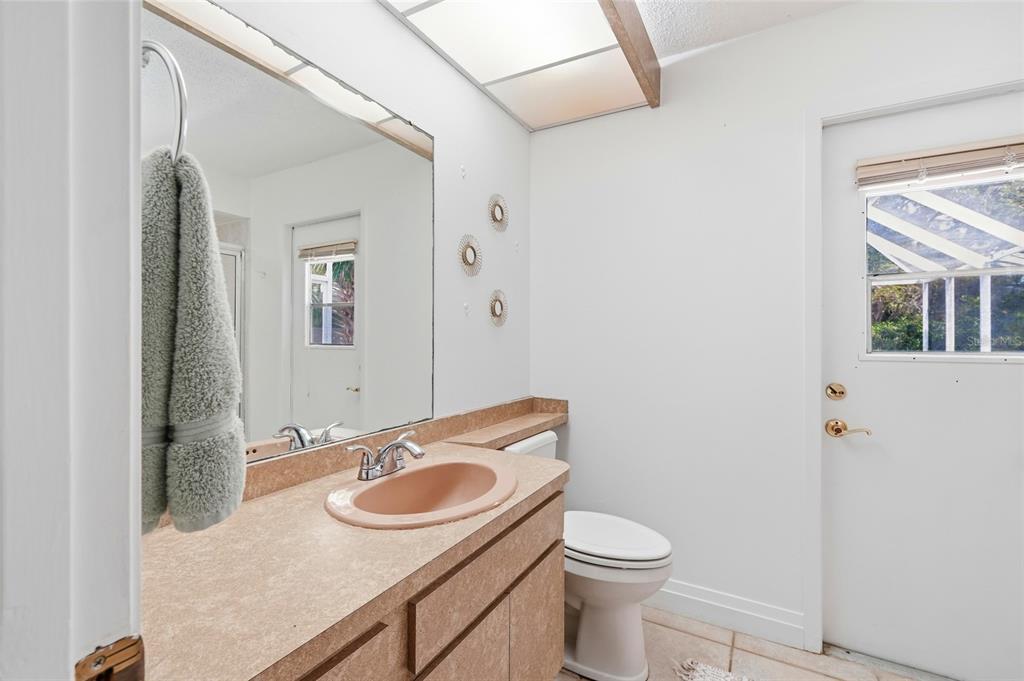 3927 Country View Lane Sarasota, FL 34233 - Photo 34 of 48 a bathroom with a sink and a toilet