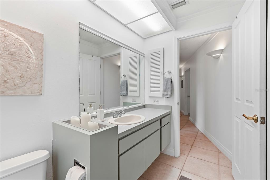 3927 Country View Lane Sarasota, FL 34233 - Photo 40 of 48 a bathroom with a sink toilet and shower
