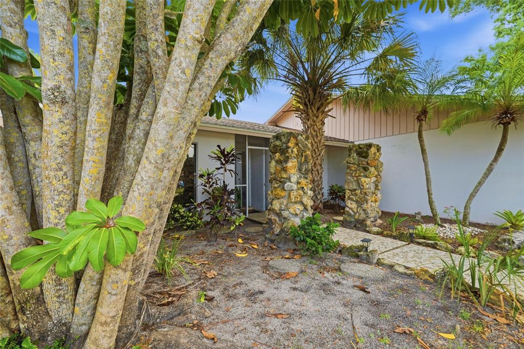 3927 Country View Lane Sarasota, FL 34233 - Photo 48 of 48 a front view of a house with a yard