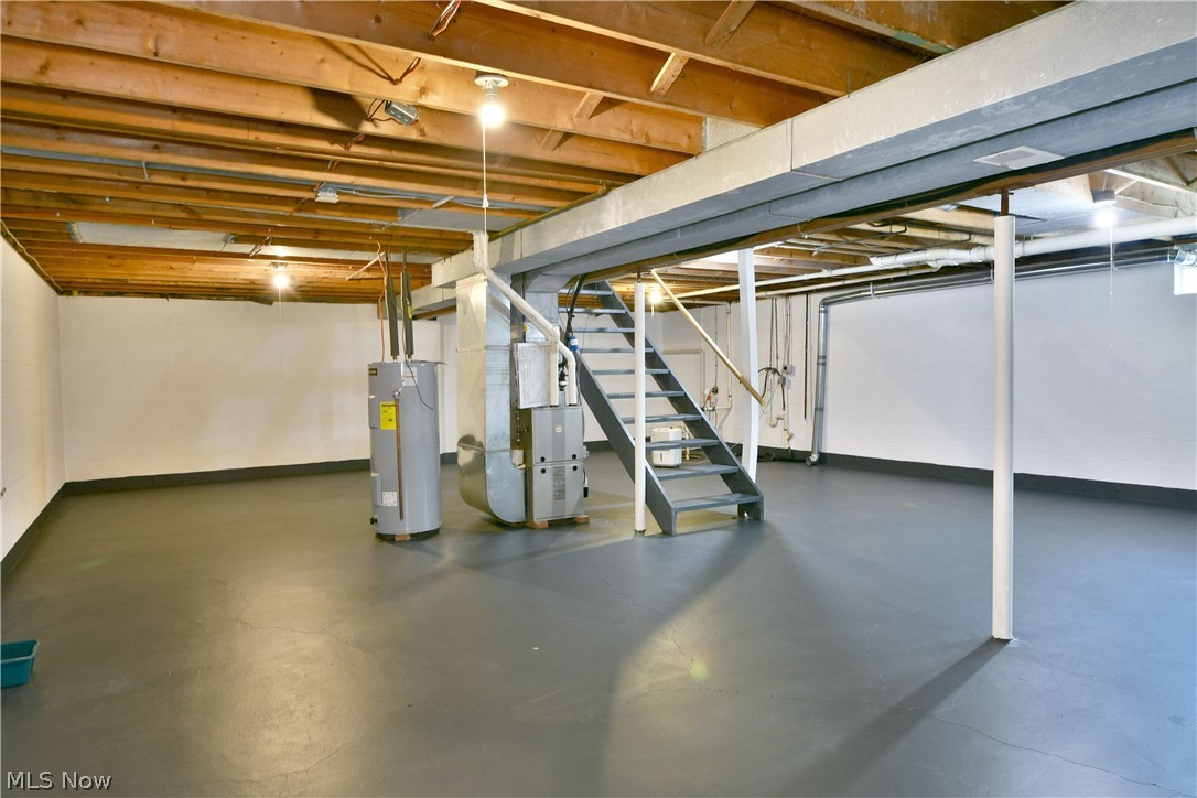 754 Warner Road Hubbard, OH 44425 - Photo 40 of 46 Expansive lower level featuring painted concrete flooring and white walls