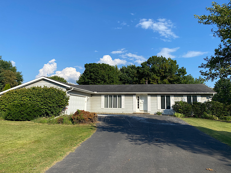 1628 North 2510th Road Ottawa, IL 61350 - Photo 1 of 24 a front view of a house with a yard and potted plants