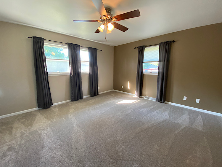 1628 North 2510th Road Ottawa, IL 61350 - Photo 11 of 24 a view of a big room with windows and chandelier fan
