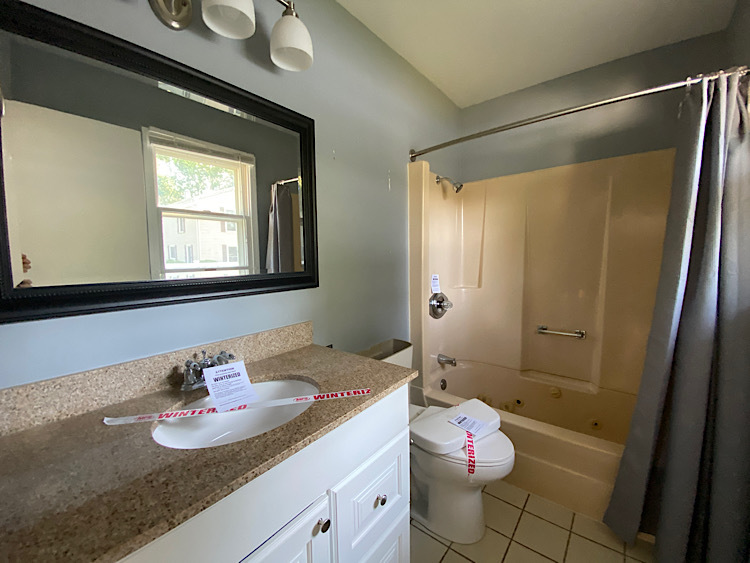 1628 North 2510th Road Ottawa, IL 61350 - Photo 14 of 24 a bathroom with a sink vanity mirror and toilet