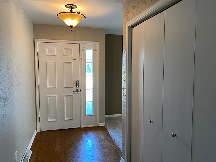 1628 North 2510th Road Ottawa, IL 61350 - Photo 3 of 24 an empty room with wooden floor and closet area
