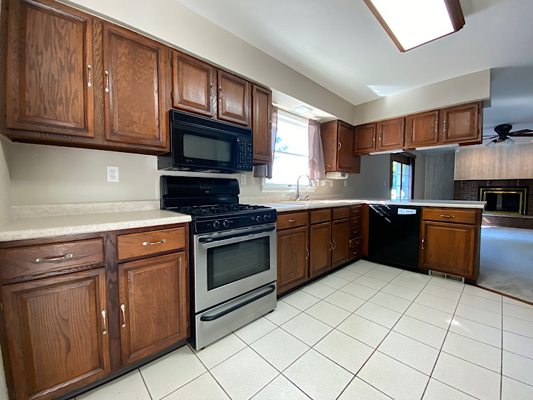 1628 North 2510th Road Ottawa, IL 61350 - Photo 7 of 24 a kitchen with stainless steel appliances granite countertop a stove microwave and sink