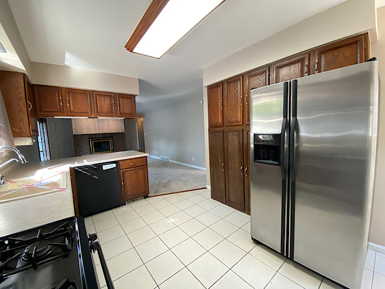 1628 North 2510th Road Ottawa, IL 61350 - Photo 8 of 24 a kitchen with a refrigerator and a stove top oven