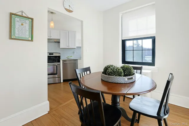 a view of a dining room with furniture and window