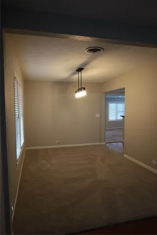 a view of an empty room and window