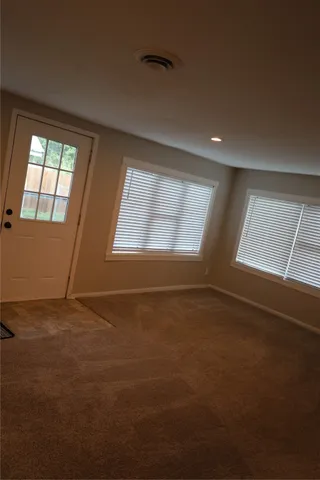 an empty room with windows