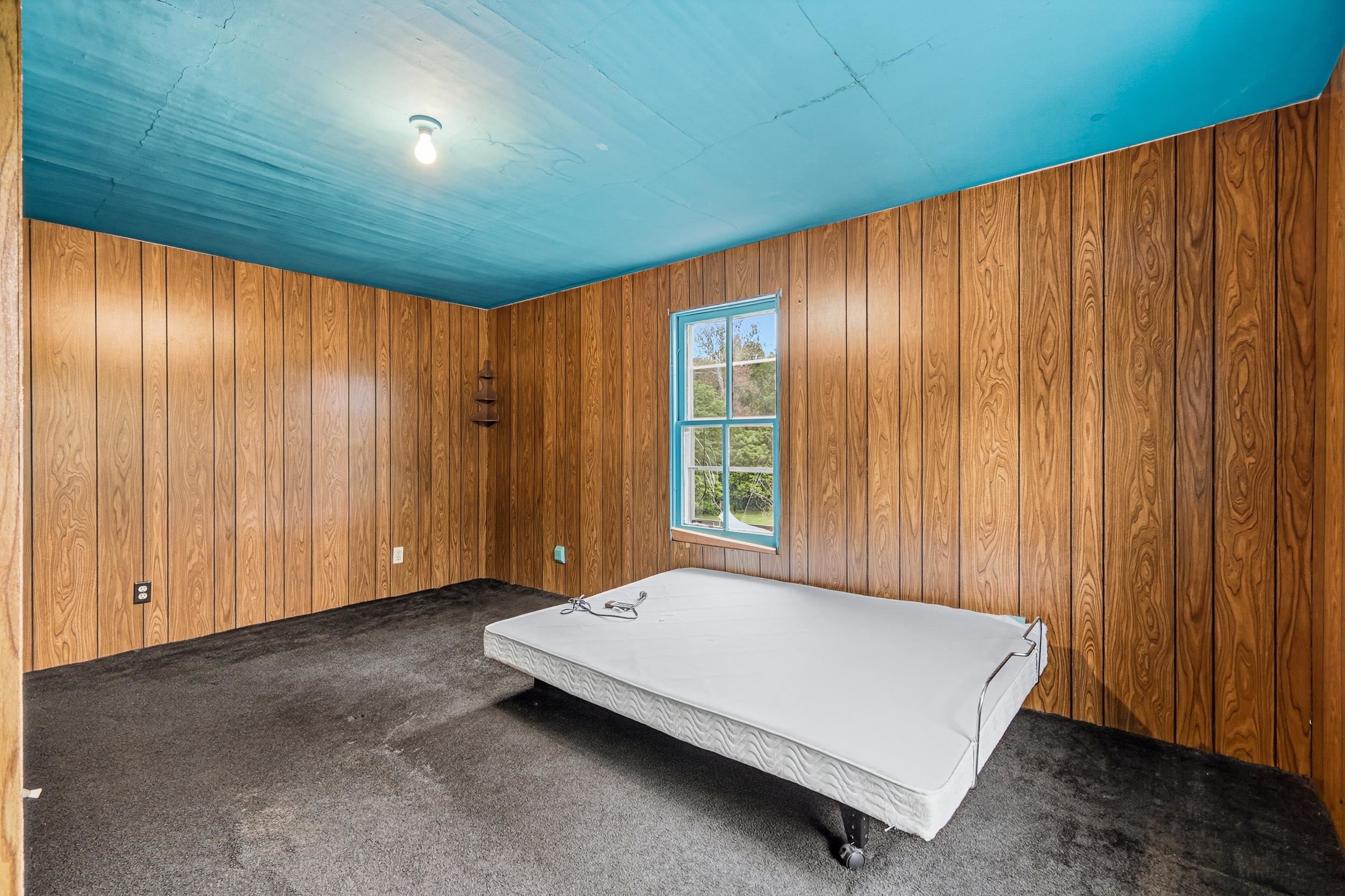 13896 Rockingham Pike Elkton, VA 22827 - Photo 46 of 60 a spacious bedroom with a bed and a window