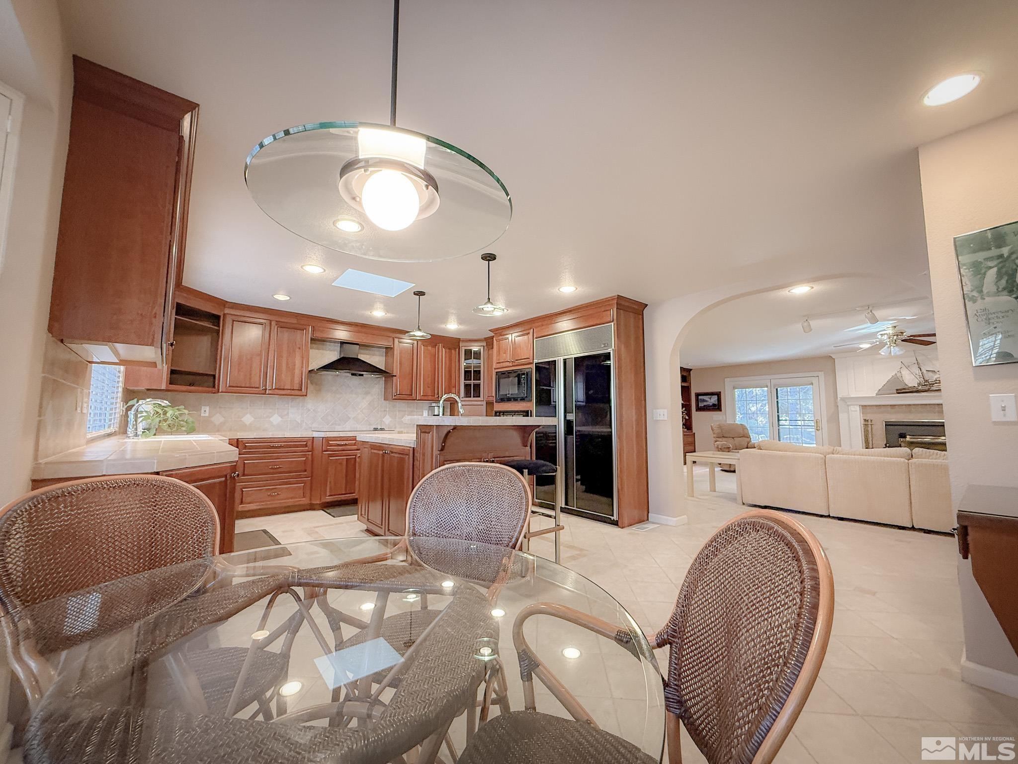 3775 Clover Way Reno, NV 89509 - Photo 11 of 40 a living room with furniture and a chandelier