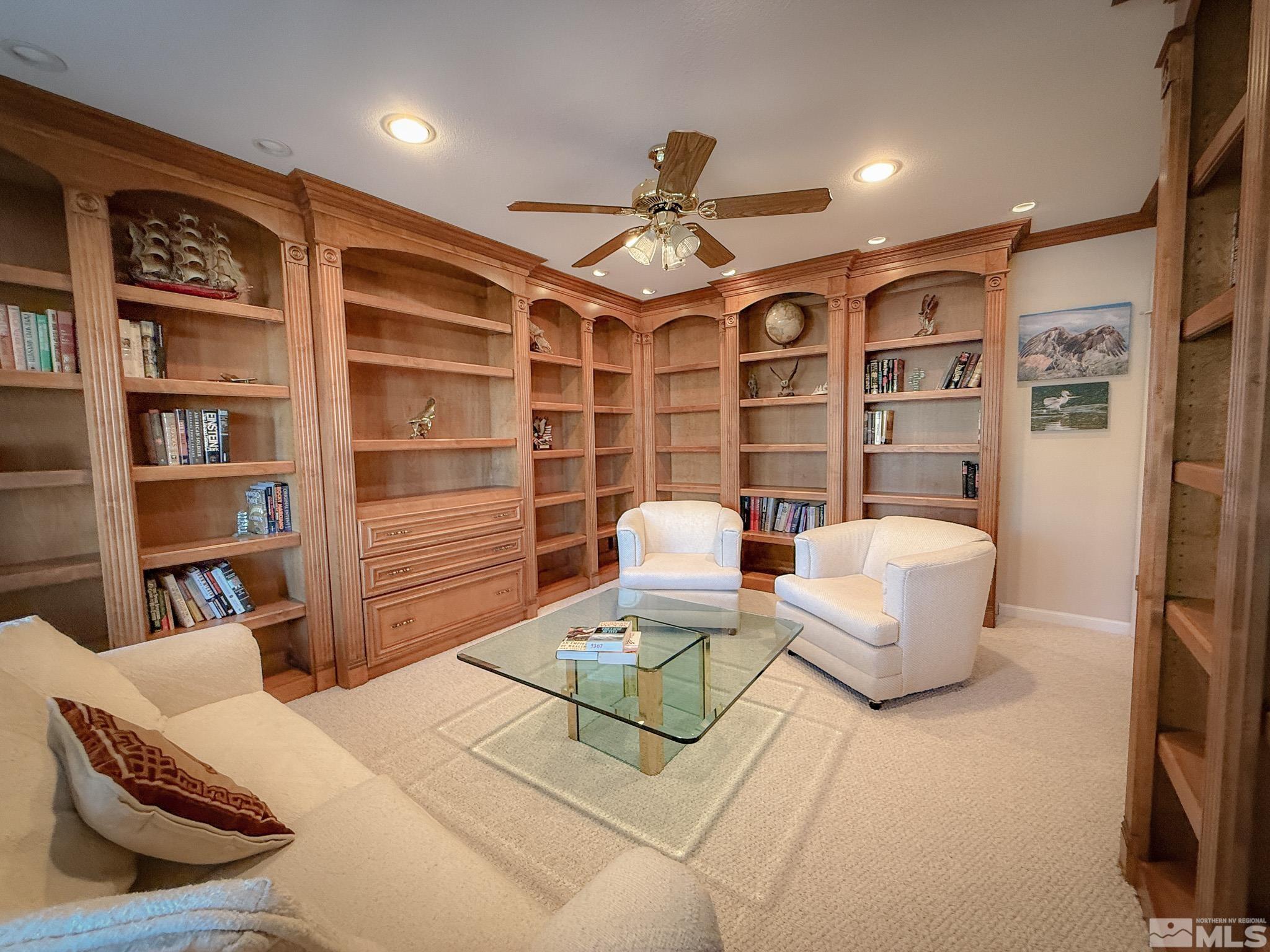 3775 Clover Way Reno, NV 89509 - Photo 25 of 40 a living room with furniture and a book shelf