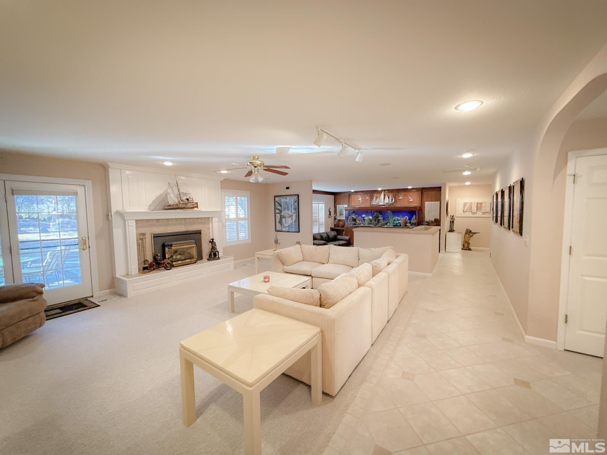 3775 Clover Way Reno, NV 89509 - Photo 4 of 40 a living room with furniture and a fireplace