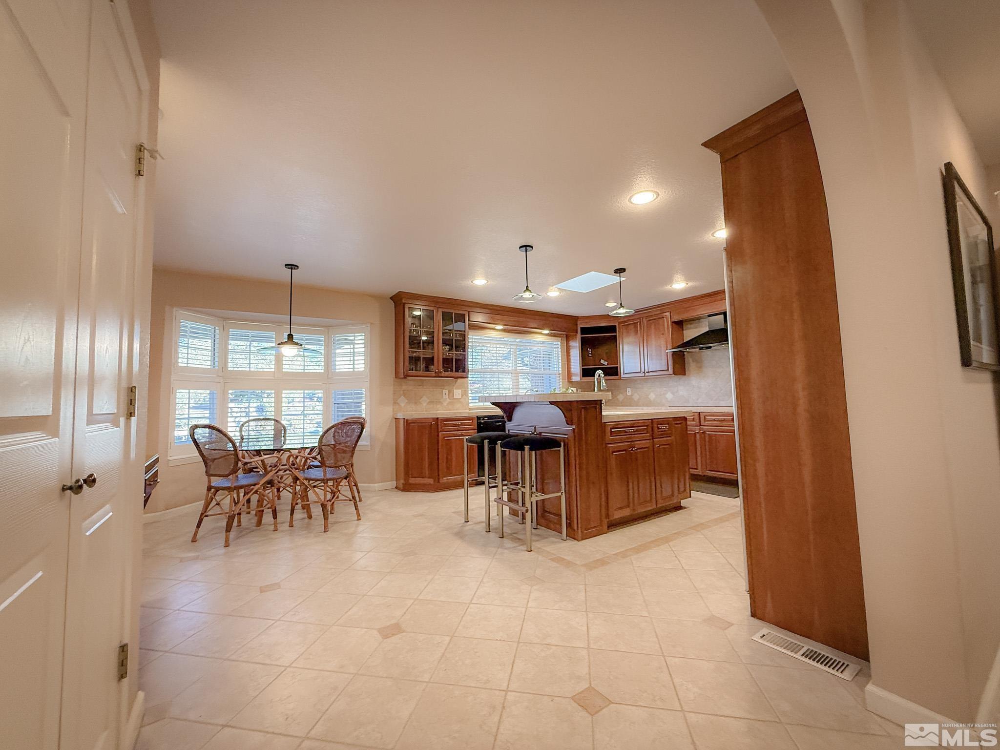 3775 Clover Way Reno, NV 89509 - Photo 8 of 40 a view of a dining area with furniture window and outside view