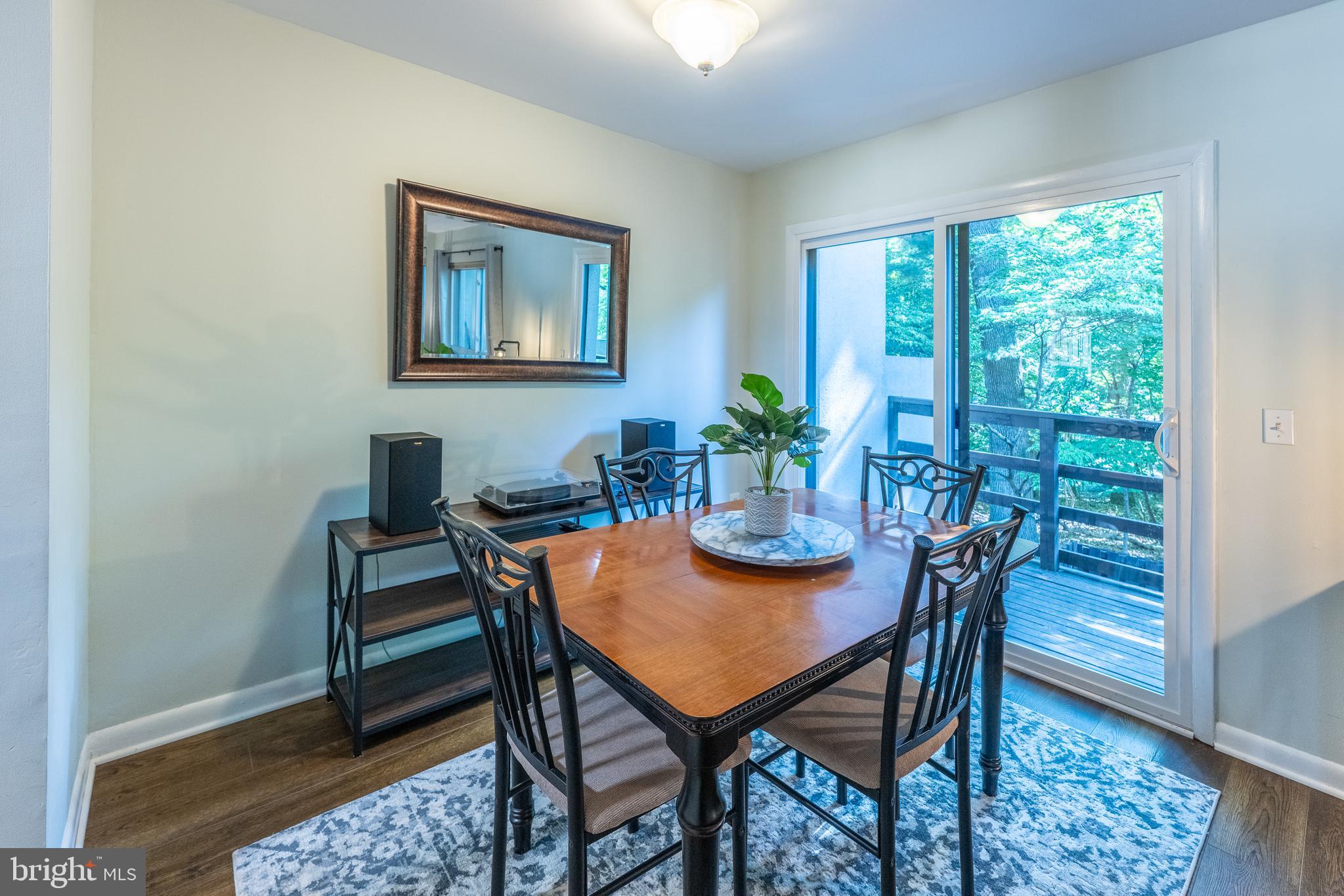 11917 Barrel Cooper Court Reston, VA 20191 - Photo 9 of 59 a view of a dining room with furniture window and wooden floor