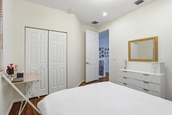 a bedroom with a bed and a cabinets