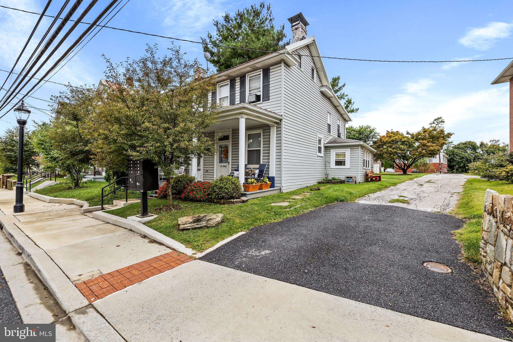 1030 South Main Street Hampstead, MD 21074 - Photo 1 of 20 a front view of a house with a yard and trees
