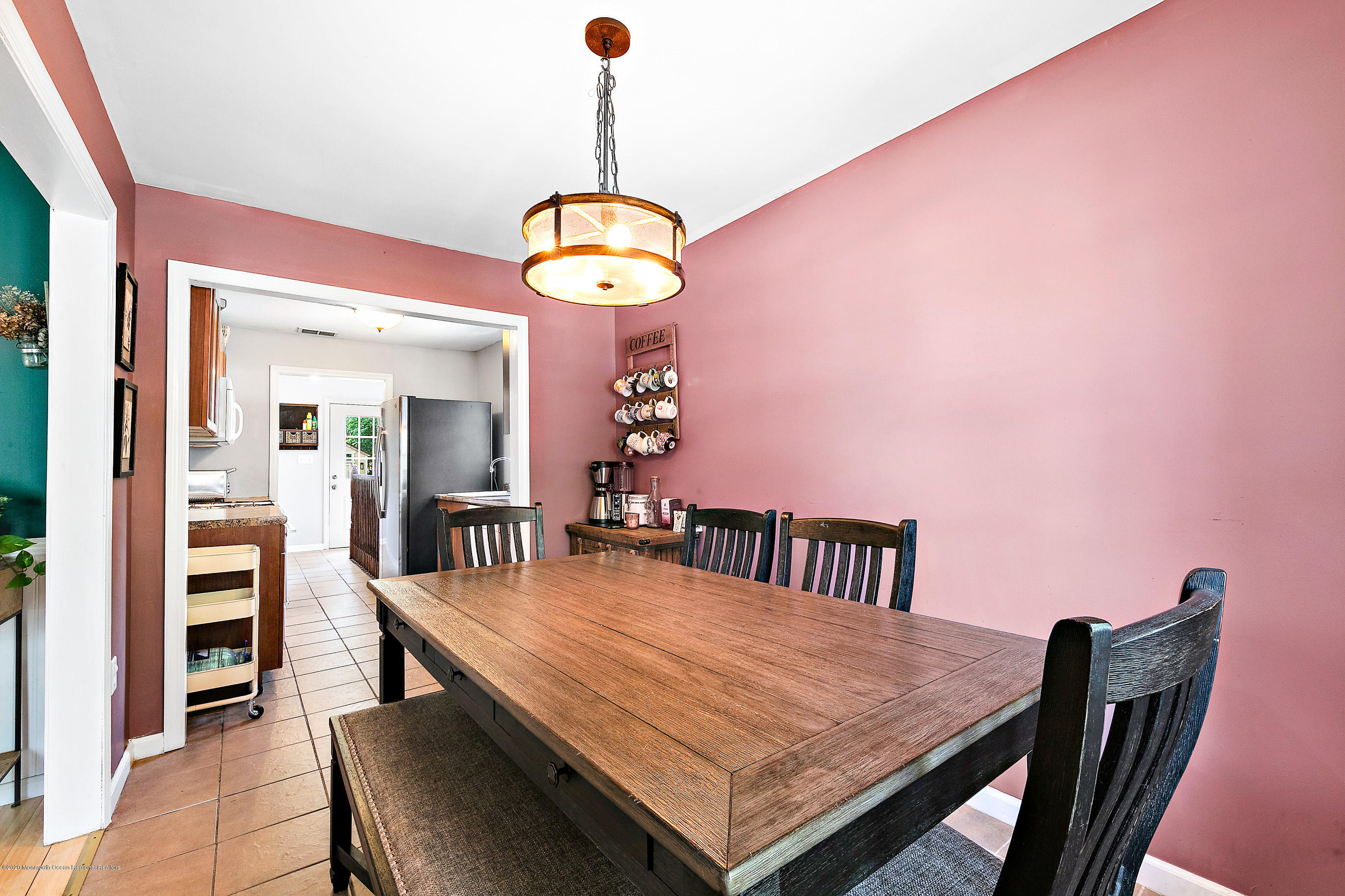 47 Dock Road Brick, NJ 08723 - Photo 12 of 44 a view of a dining room with furniture and a chandelier