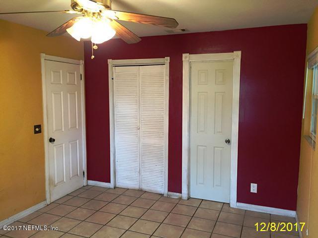 7345 Ridgeway Road North Jacksonville, FL 32244 - Photo 13 of 26 a view of an empty room with window and chandelier fan