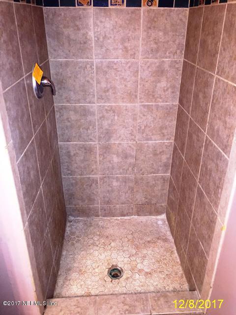 7345 Ridgeway Road North Jacksonville, FL 32244 - Photo 14 of 26 a bathroom with a shower