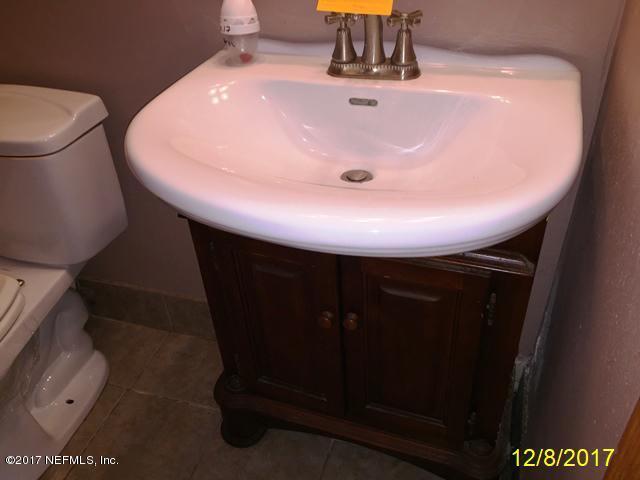 7345 Ridgeway Road North Jacksonville, FL 32244 - Photo 15 of 26 a bathroom with a sink