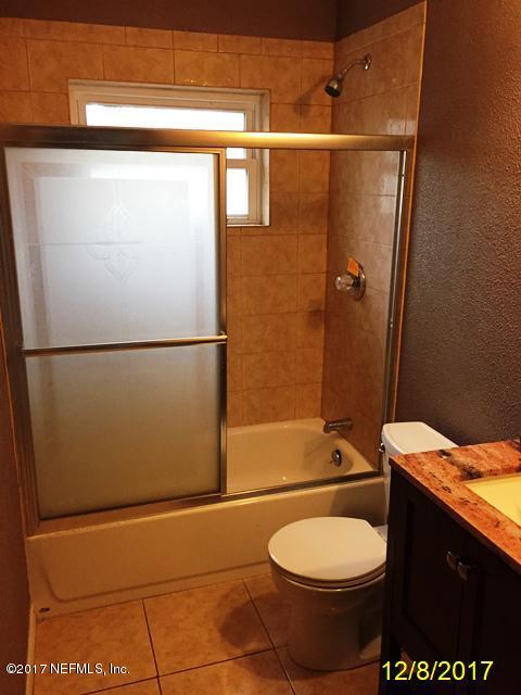 7345 Ridgeway Road North Jacksonville, FL 32244 - Photo 20 of 26 a bathroom with a toilet a sink and shower