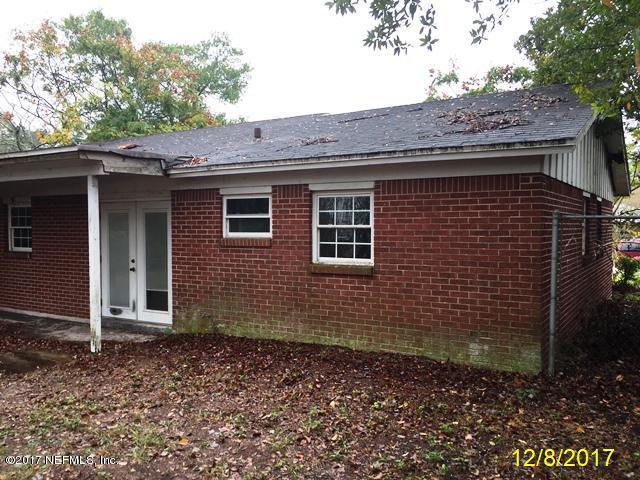 7345 Ridgeway Road North Jacksonville, FL 32244 - Photo 22 of 26 a brick house with a large window