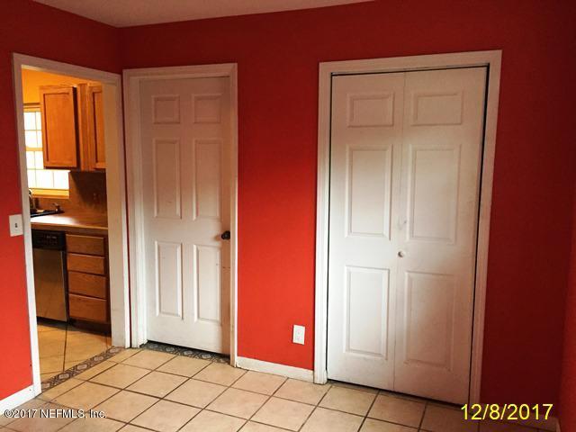 7345 Ridgeway Road North Jacksonville, FL 32244 - Photo 6 of 26 an empty room with windows and entrance