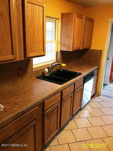 7345 Ridgeway Road North Jacksonville, FL 32244 - Photo 8 of 26 a kitchen with a sink and cabinets