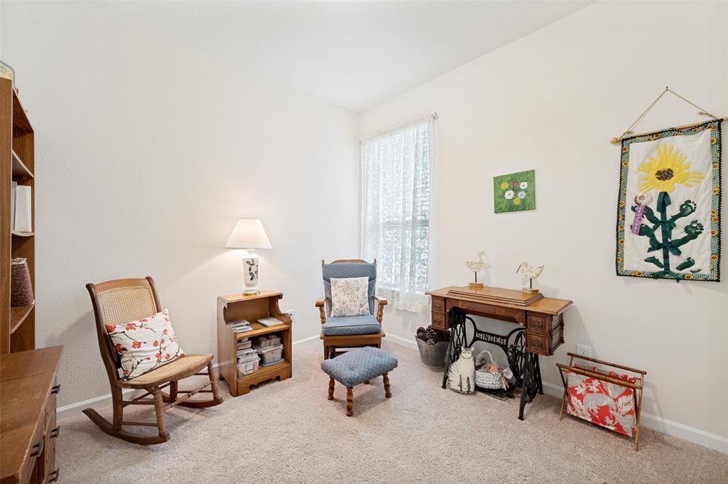 413 Wiggins Way Van Alstyne, TX 75495 - Photo 20 of 25 Carpeted room featuring a single window with sheer white curtains, light neutral walls, and baseboard trim