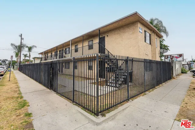 a view of a wrought iron fences in front of house