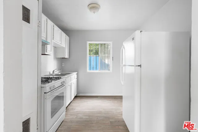 a bathroom with a sink a toilet and a bathtub