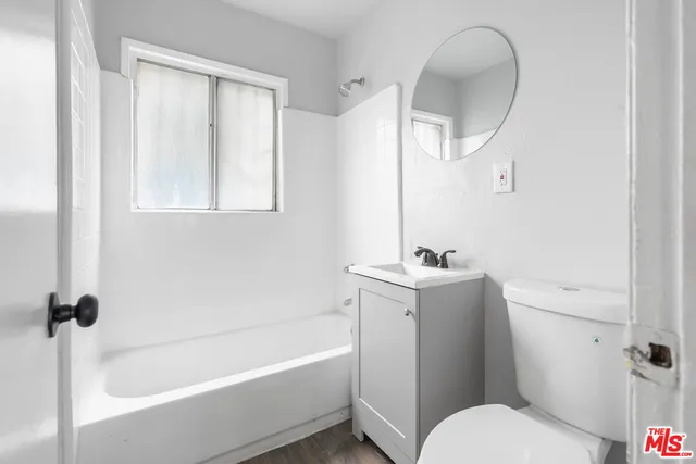 a view of a livingroom with wooden floor
