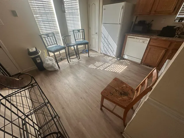 a view of furniture in wooden floor