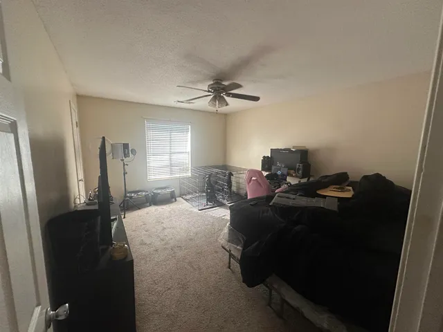 a living room with furniture window and a chandelier