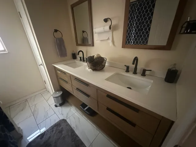 a bathroom with a sink and a mirror