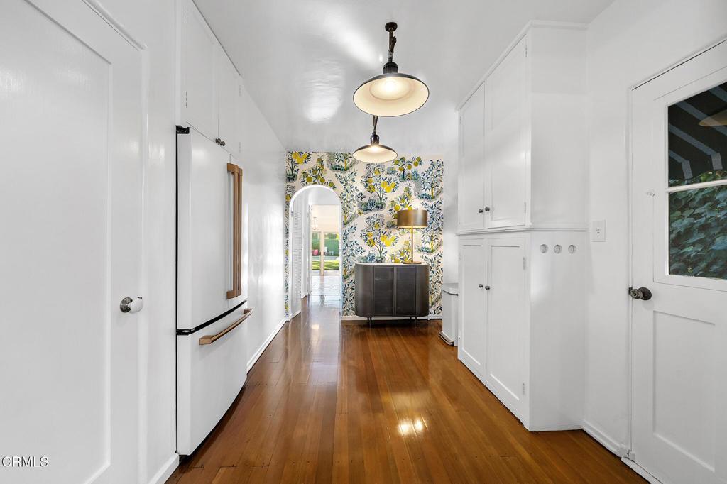 1765 Westhaven Road San Marino, CA 91108 - Photo 20 of 71 a view of a hallway with wooden floor and a living room