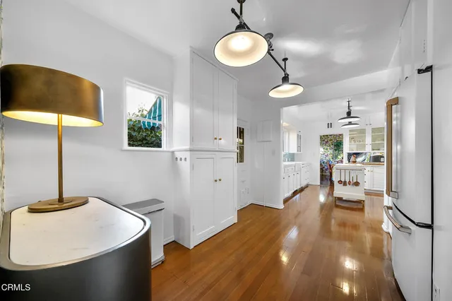 a living room with furniture a fireplace and a table